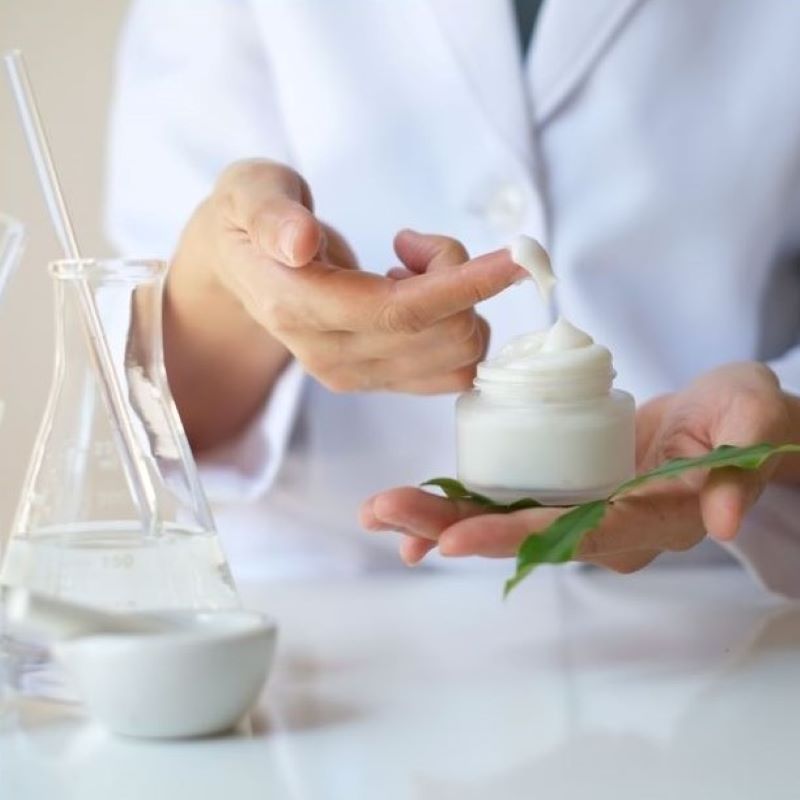 A formulator tests a dollop of lotion.