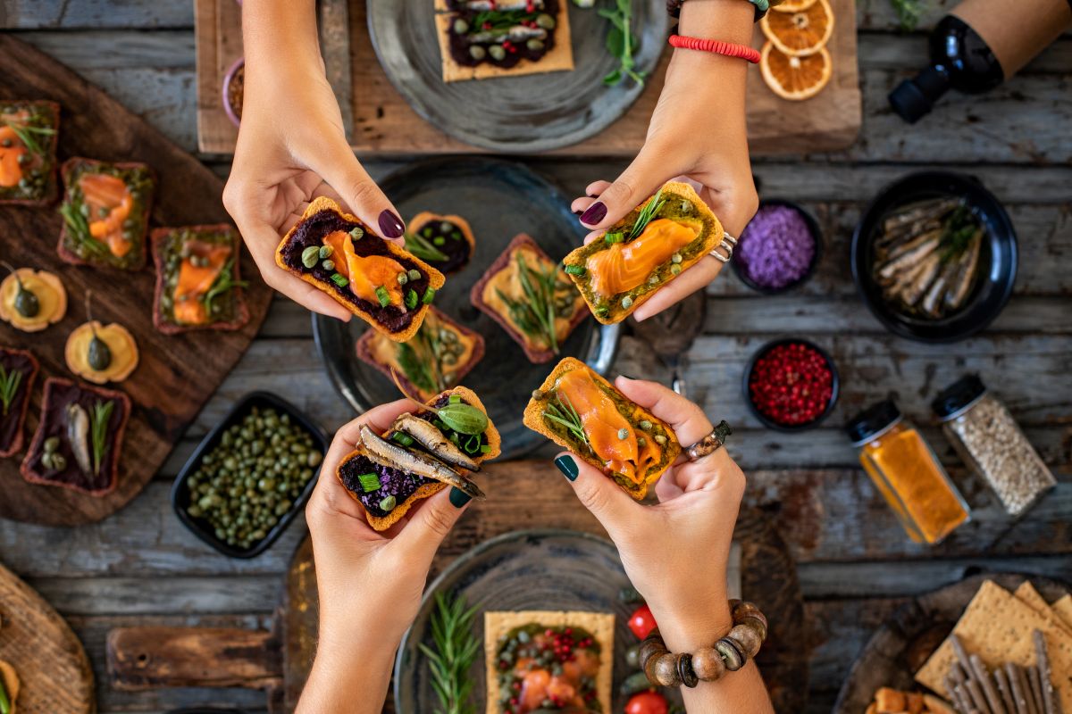 table with fish foods on toast