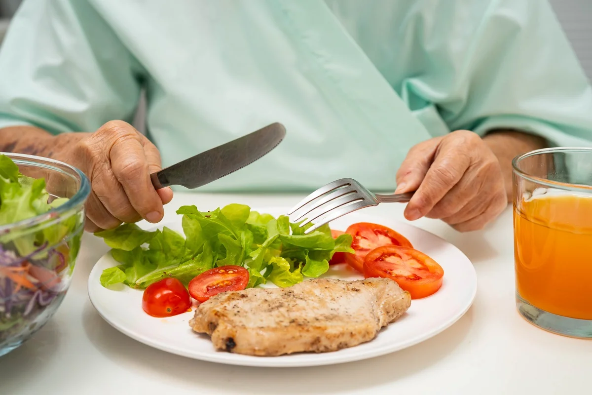 Patient eating hospital food
