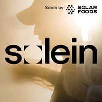 Solein by Solar Foods logo in bold black lettering against a warm, golden background featuring a silhouetted person.