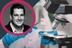Azitra video thumbnail: Laboratory researcher handling a sample beside a microscope, with a black-and-white portrait inset in a pink circular frame Azitra video thumbnail: Laboratory researcher handling a sample beside a microscope, with a black-and-white portrait inset in a pink circular frame