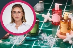 Image Woman wearing glasses and a white shirt beside LENOSE scented hand soaps displayed on green tiles with bubbles.