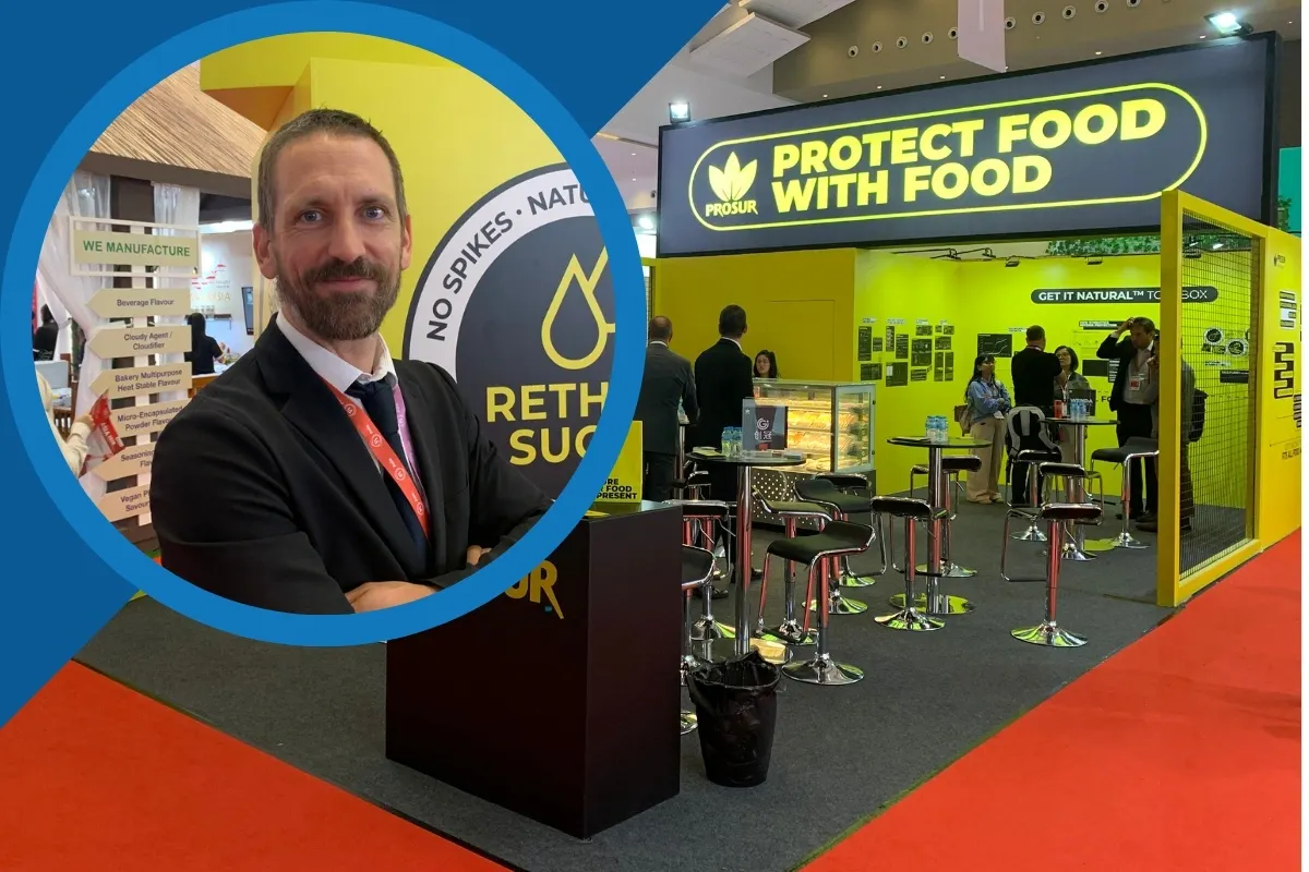 Fi Asia 2026 Prosur video thumbnail: A man in a black suit stands in front of the bright yellow PROSUR exhibition booth at a food industry trade show.