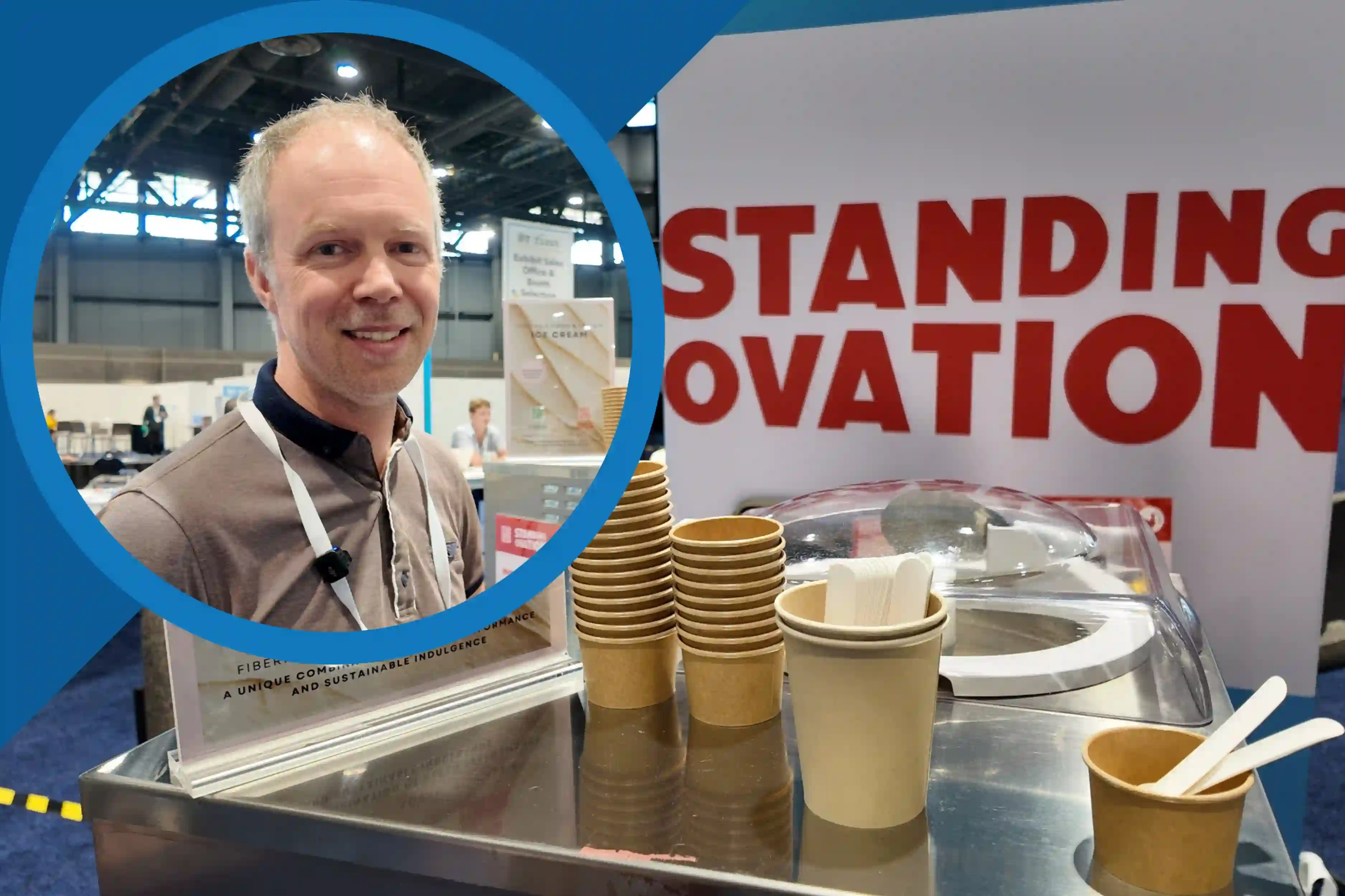 Image IFT First 2026 Standing Ovation video thumbnail: Smiling exhibitor beside paper sample cups and spoons at a trade show booth promoting sustainable food innovation